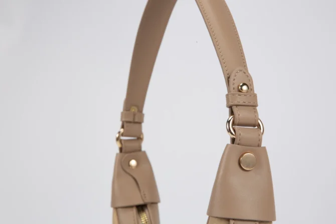 A petite women's handbag with an elegant design - beige